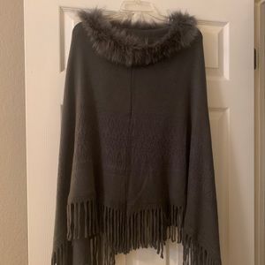 Beautiful fake fur trimmed poncho. One size fits all